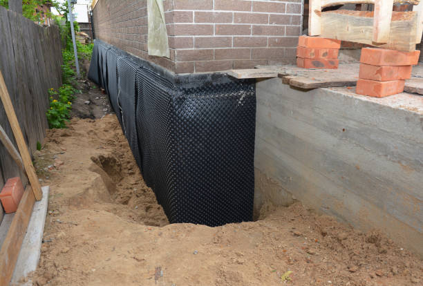 SJ Waterproofing Pros technician performing targeted Waterproofing assessment in Random Lake, WI